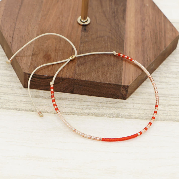 Olivenorma Braccialetto con coulisse beige con perline di riso colorate 