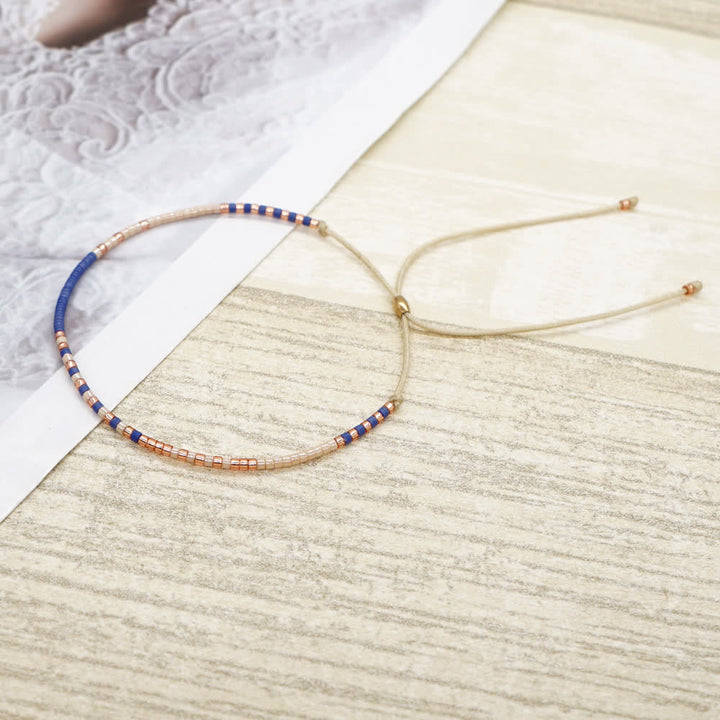 Olivenorma Braccialetto con coulisse beige con perline di riso colorate 