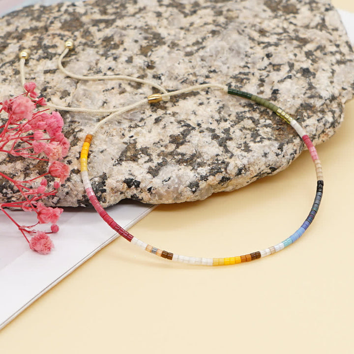 Olivenorma Braccialetto con coulisse beige con perline di riso colorate 