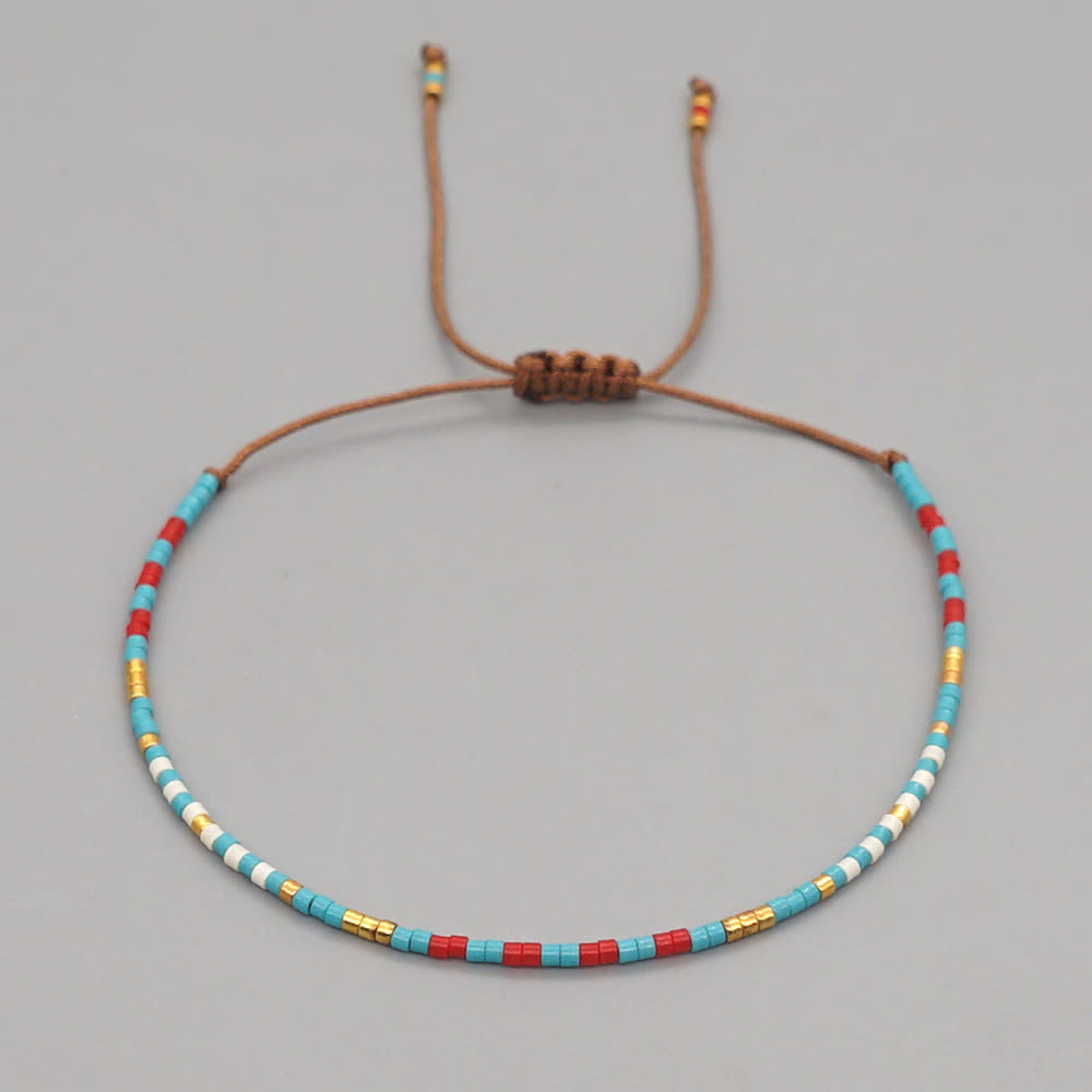 Olivenorma Braccialetto intrecciato marrone con perline di riso colorate 