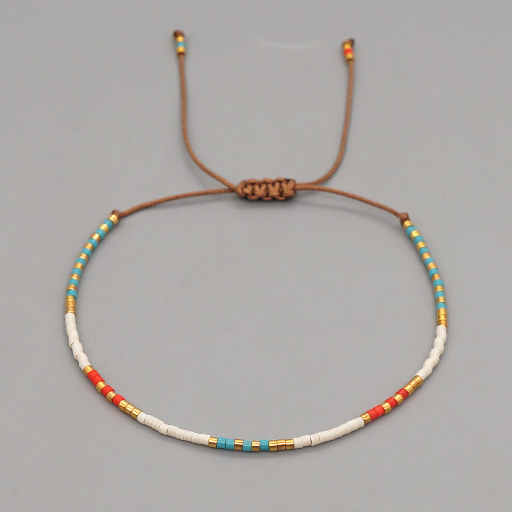 Olivenorma Braccialetto intrecciato marrone con perline di riso colorate 