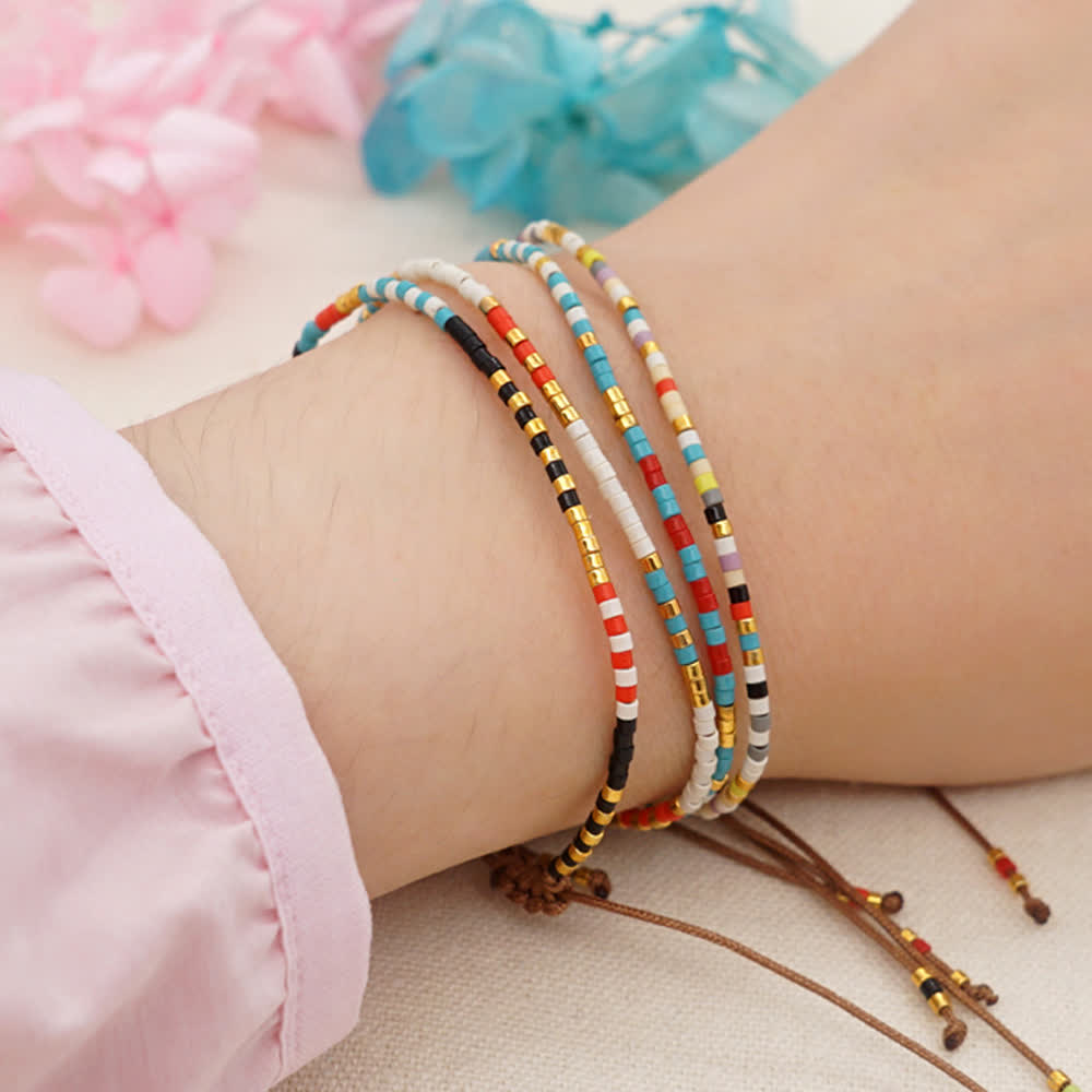 Olivenorma Braccialetto intrecciato marrone con perline di riso colorate 