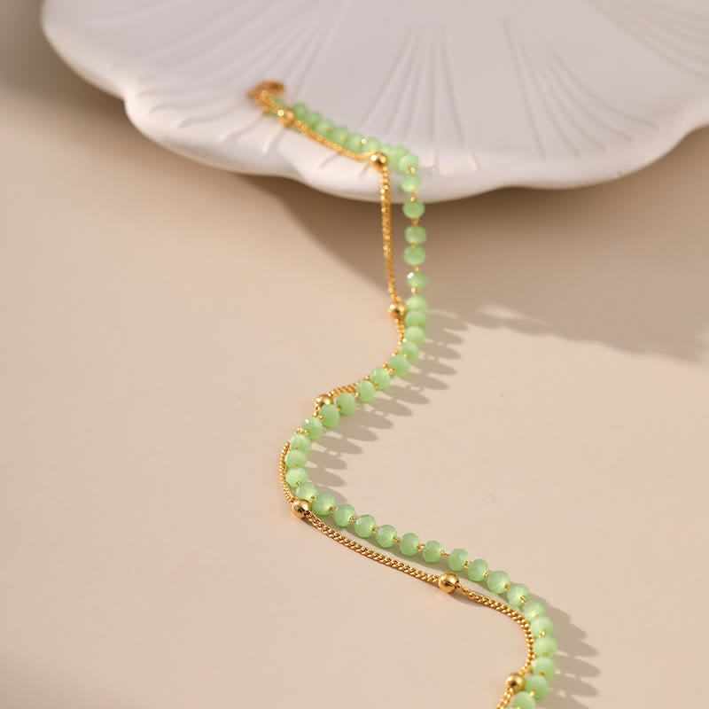 Olivenorma Cavigliera con perline placcata in oro e peridoto naturale