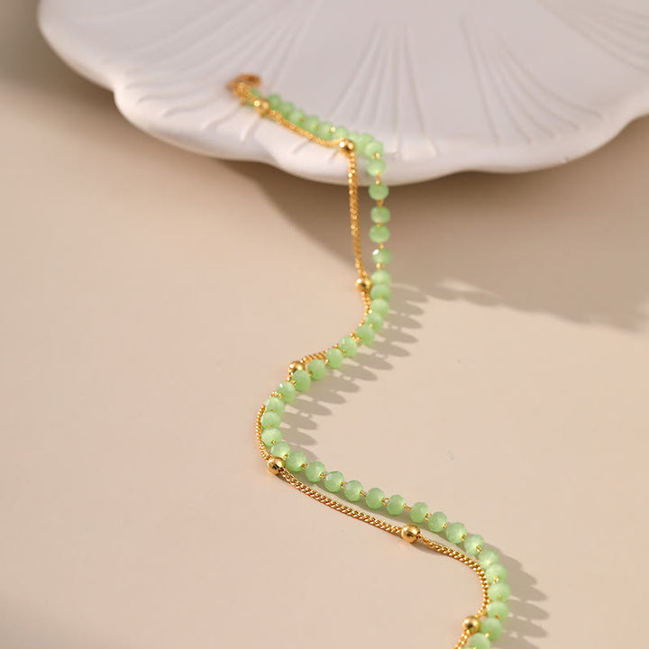 Olivenorma Cavigliera con perline placcata in oro e peridoto naturale