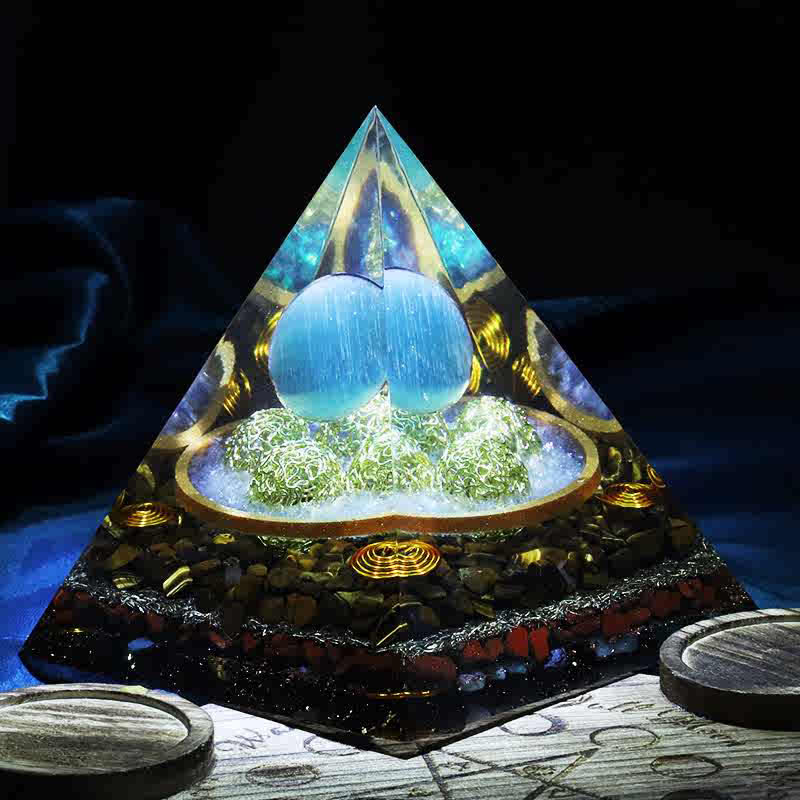 Olivenorma 14cm Piramide di Orgone in Pietra Occhio di Gatto Blu