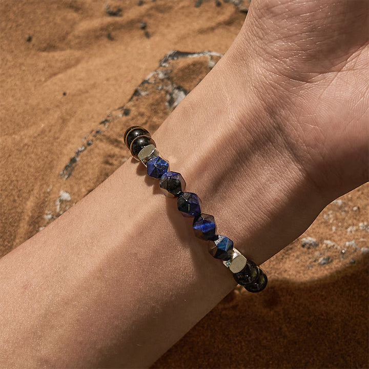 Bracciale Olivenorma in perline di ossidiana blu sfaccettata con occhio di tigre