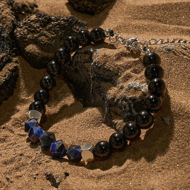 Bracciale Olivenorma in perline di ossidiana blu sfaccettata con occhio di tigre