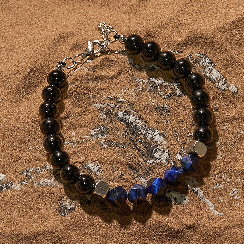 Bracciale Olivenorma in perline di ossidiana blu sfaccettata con occhio di tigre