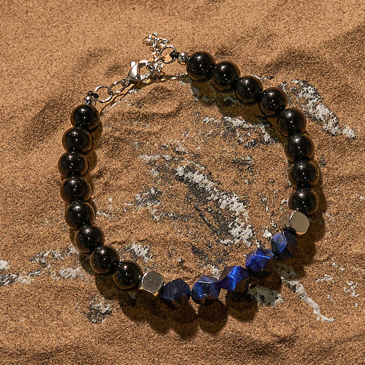 Bracciale Olivenorma in perline di ossidiana blu sfaccettata con occhio di tigre