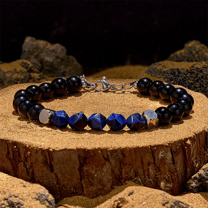 Bracciale Olivenorma in perline di ossidiana blu sfaccettata con occhio di tigre