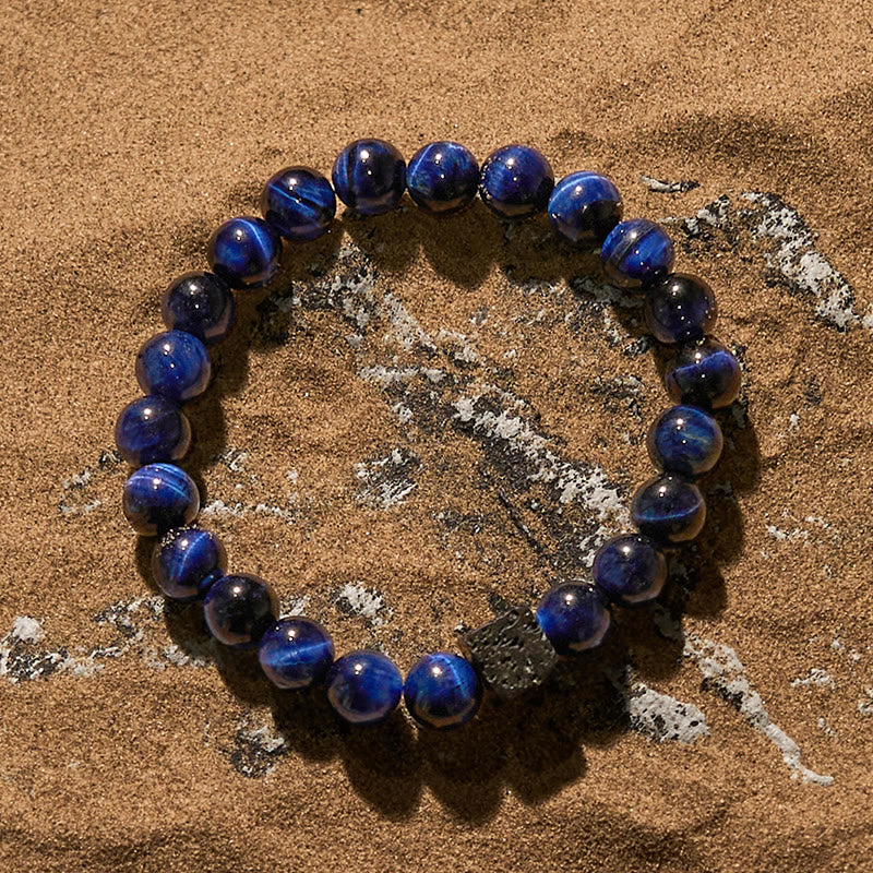 Braccialetto di perline in pietra lavica con occhio di tigre blu Olivenorma
