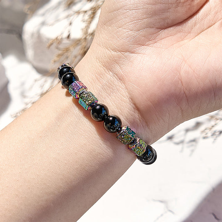 Bracciale di perline in pietra lavica e ematite elettroplaccata Olivenorma con onice nero