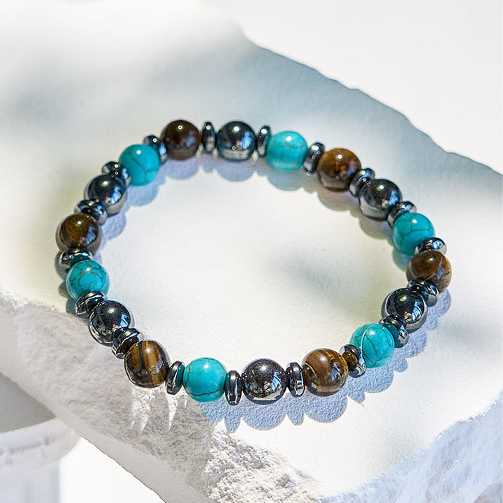 Bracciale Olivenorma in ematite, occhio di tigre, turchese e perline