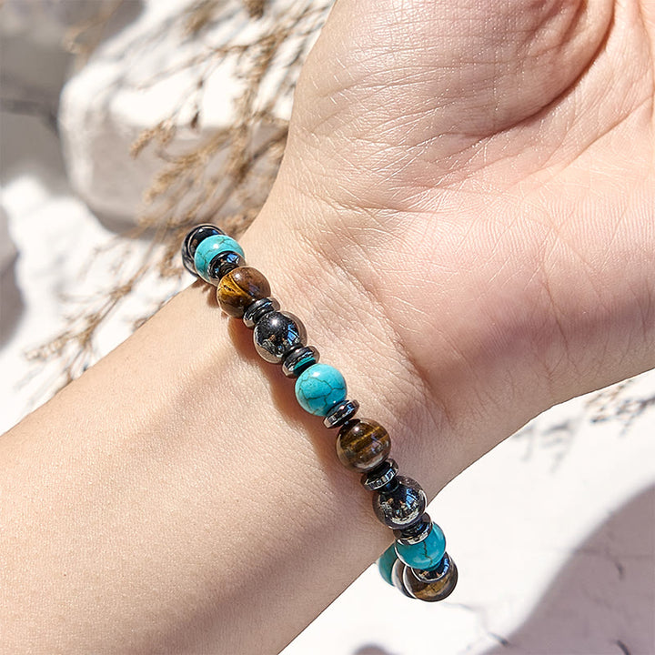 Bracciale Olivenorma in ematite, occhio di tigre, turchese e perline