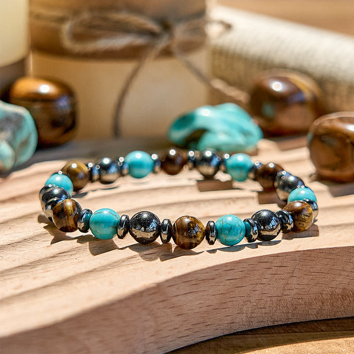Bracciale Olivenorma in ematite, occhio di tigre, turchese e perline