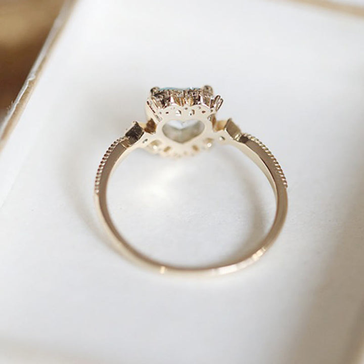 Anello Olivenorma con topazio blu naturale e zircone bianco
