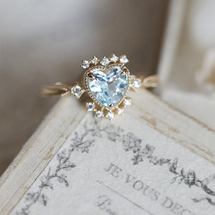 Anello Olivenorma con topazio blu naturale e zircone bianco