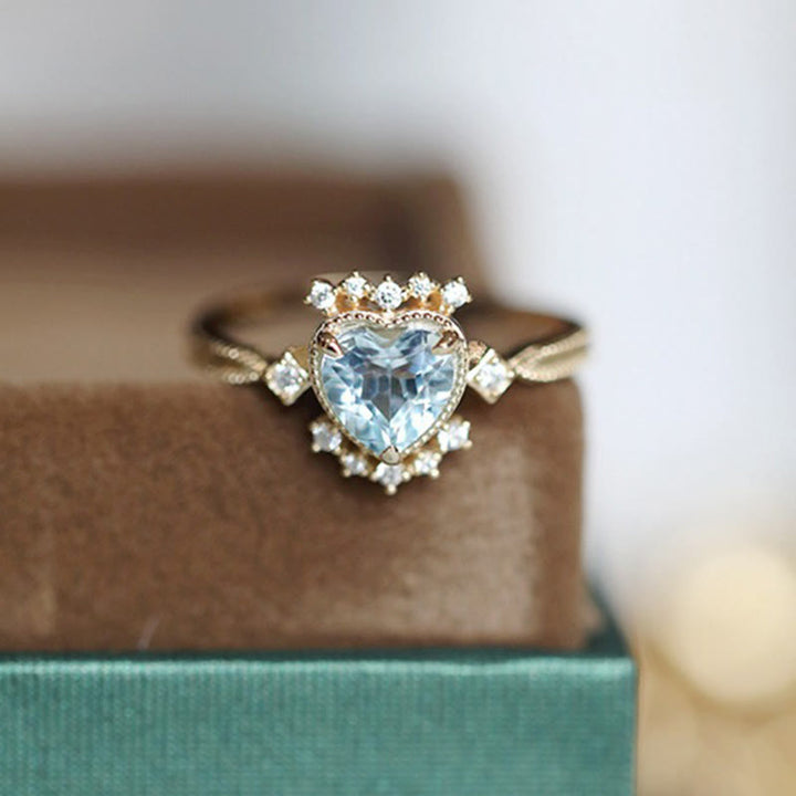 Anello Olivenorma con topazio blu naturale e zircone bianco