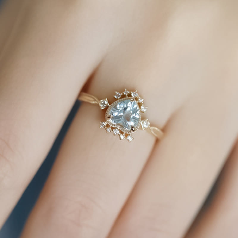 Anello Olivenorma con topazio blu naturale e zircone bianco