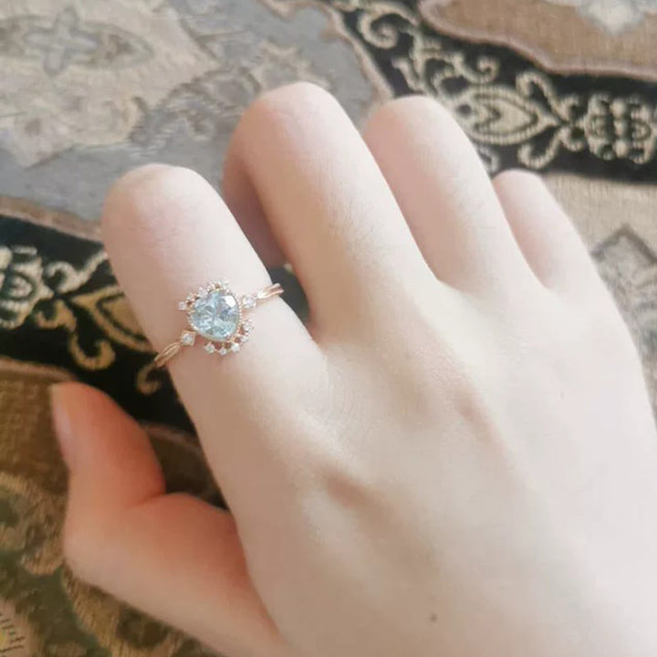Anello Olivenorma con topazio blu naturale e zircone bianco