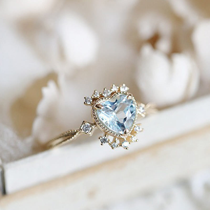 Anello Olivenorma con topazio blu naturale e zircone bianco