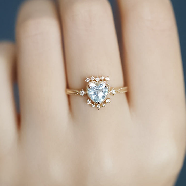 Anello Olivenorma con topazio blu naturale e zircone bianco