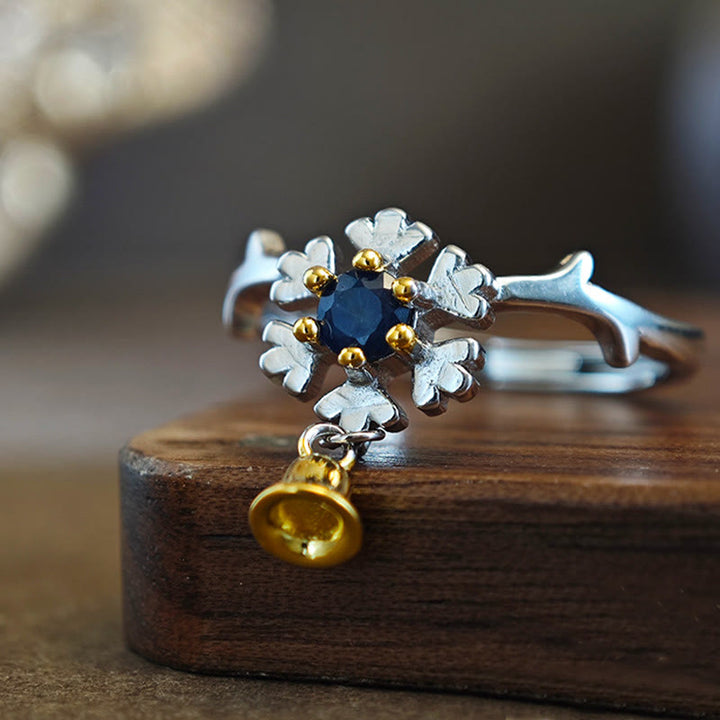 Anello in argento sterling a forma di campana con fiocco di neve e zaffiro Olivenorma