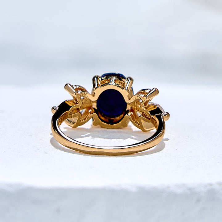 Anello Olivenorma con foglia di zircone in arenaria blu taglio ovale
