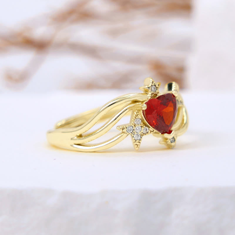 Anello Olivenorma a forma di cuore con granato e stella in zircone bianco
