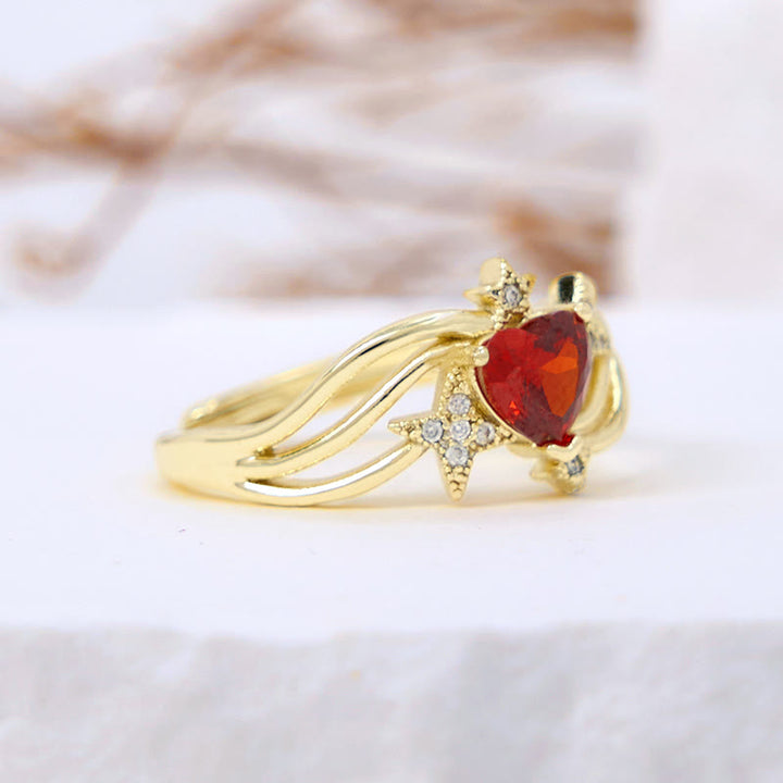 Anello Olivenorma a forma di cuore con granato e stella in zircone bianco