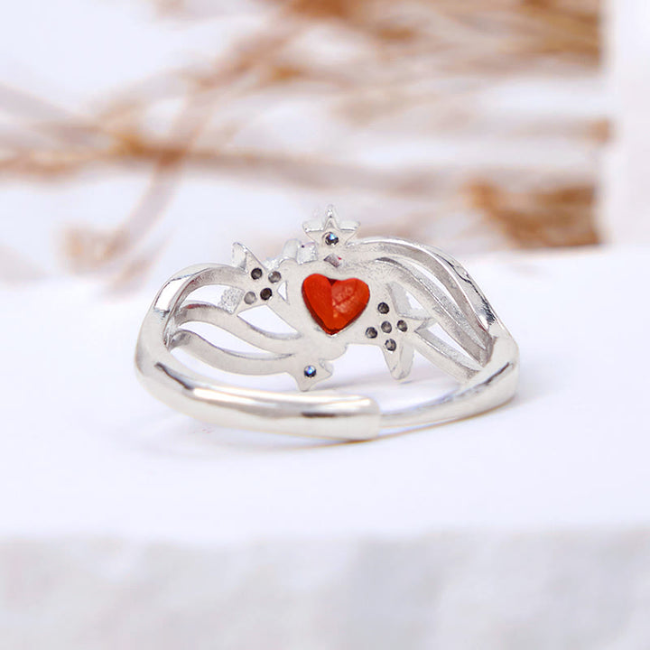 Anello Olivenorma a forma di cuore con granato e stella in zircone bianco