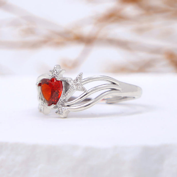 Anello Olivenorma a forma di cuore con granato e stella in zircone bianco