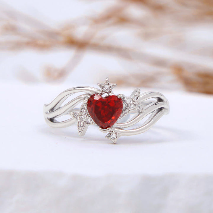 Anello Olivenorma a forma di cuore con granato e stella in zircone bianco