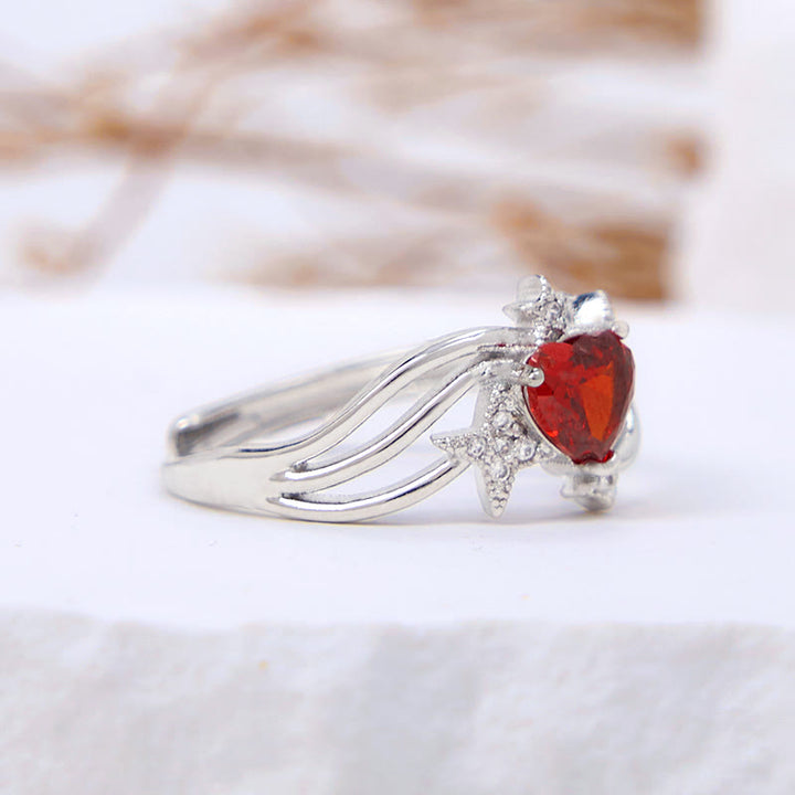 Anello Olivenorma a forma di cuore con granato e stella in zircone bianco