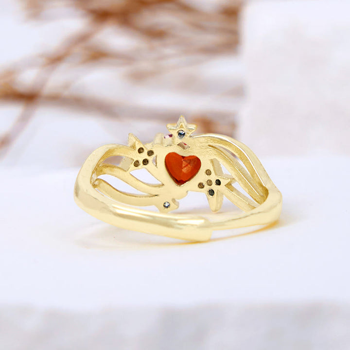 Anello Olivenorma a forma di cuore con granato e stella in zircone bianco