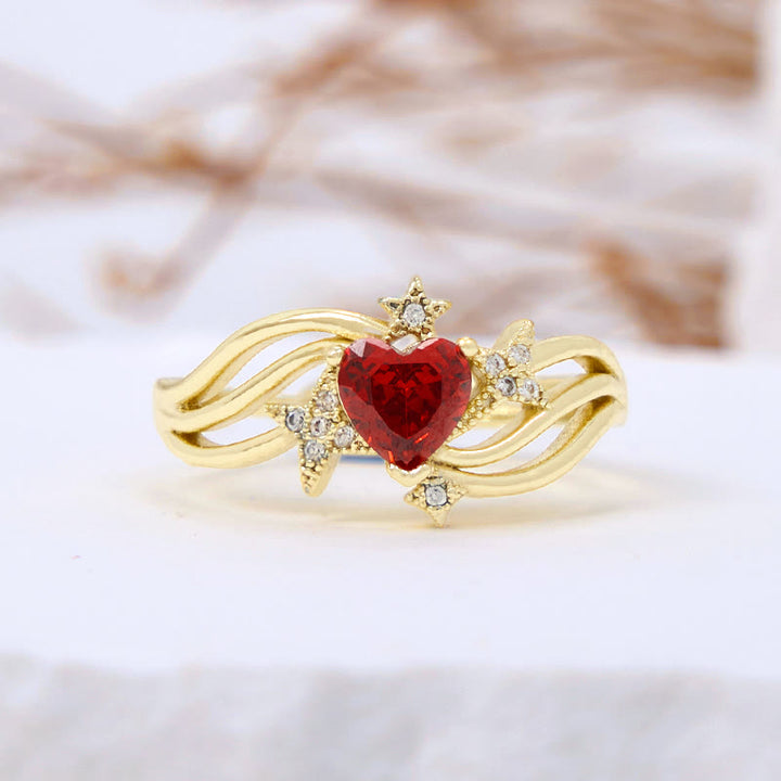 Anello Olivenorma a forma di cuore con granato e stella in zircone bianco