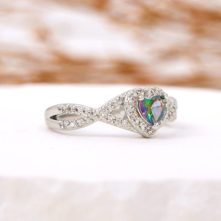 Anello Olivenorma a forma di cuore con alessandrite a forma di croce infinita