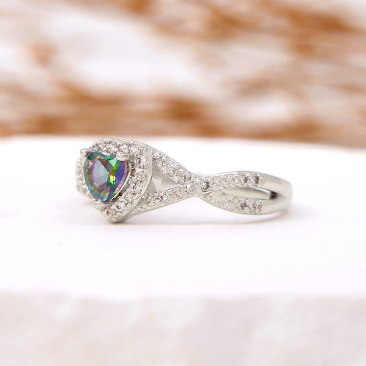 Anello Olivenorma a forma di cuore con alessandrite a forma di croce infinita