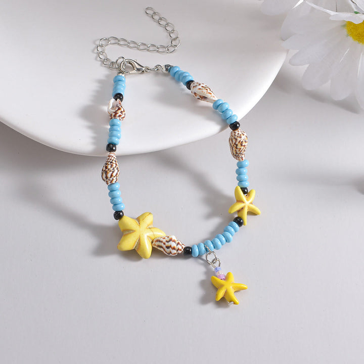 Olivenorma Cavigliera con perline, stelle marine gialle, turchesi e blu