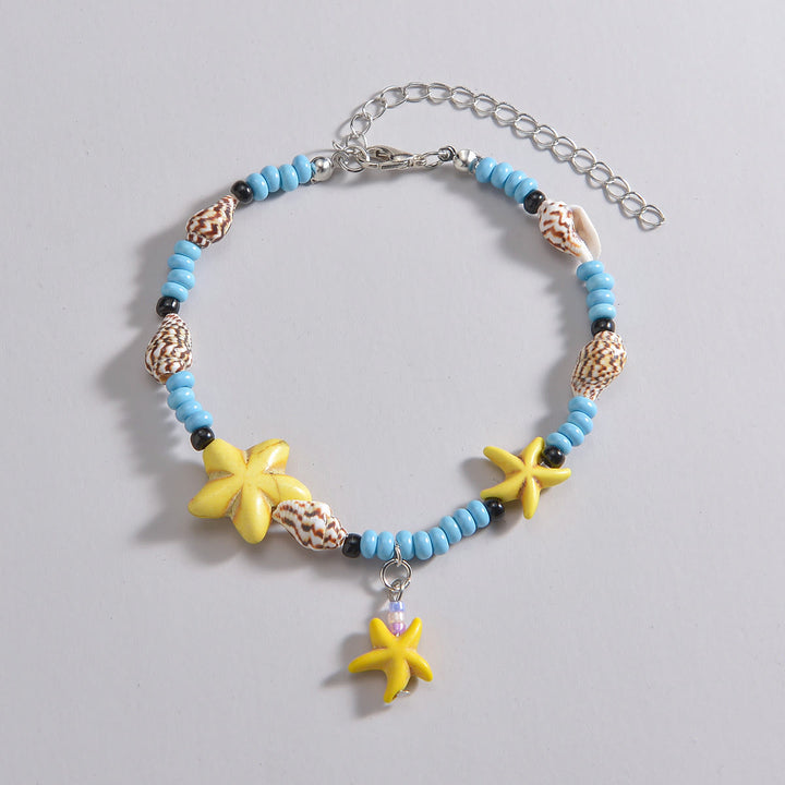 Olivenorma Cavigliera con perline, stelle marine gialle, turchesi e blu