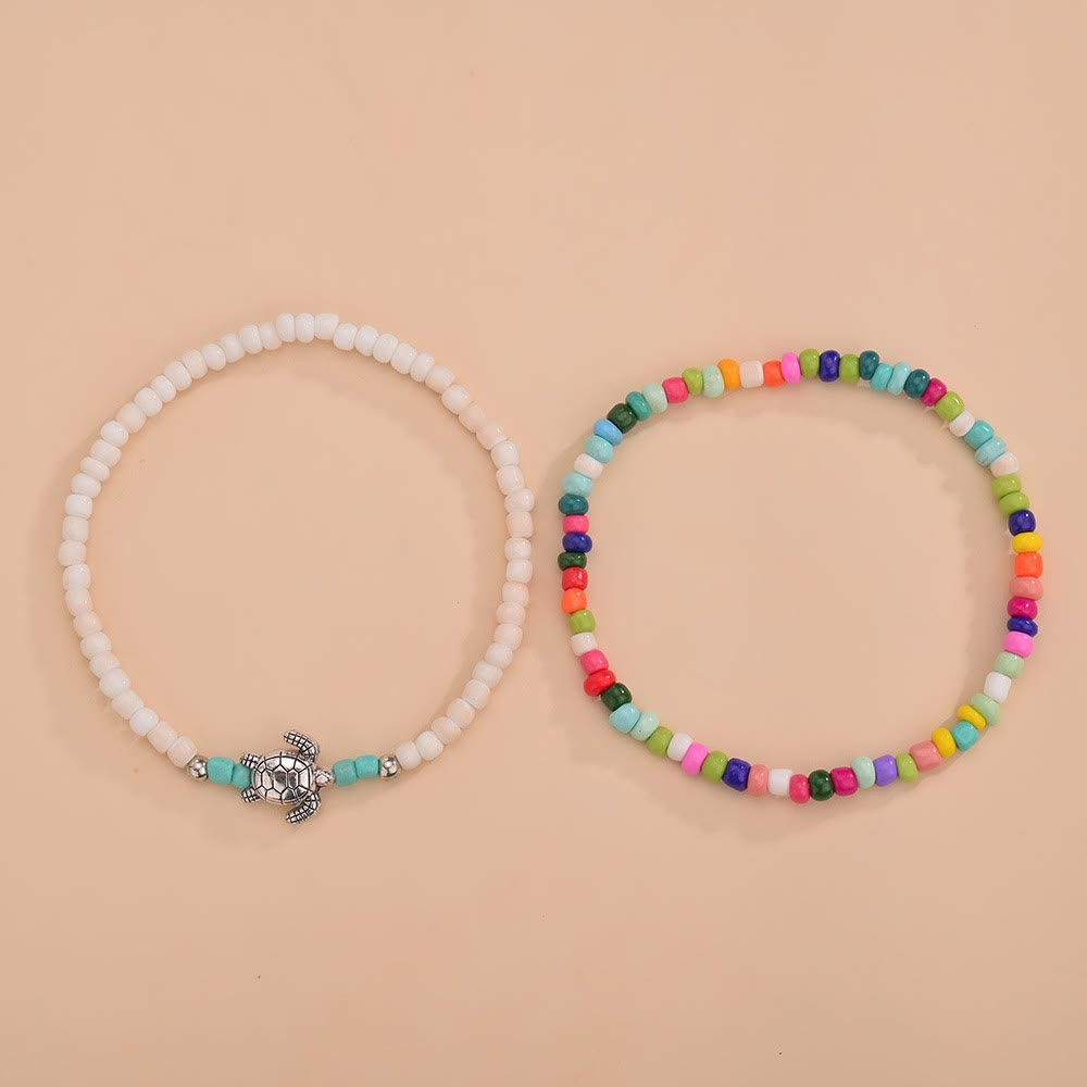 Olivenorma 2 pezzi cavigliera tartaruga con perline colorate bianche