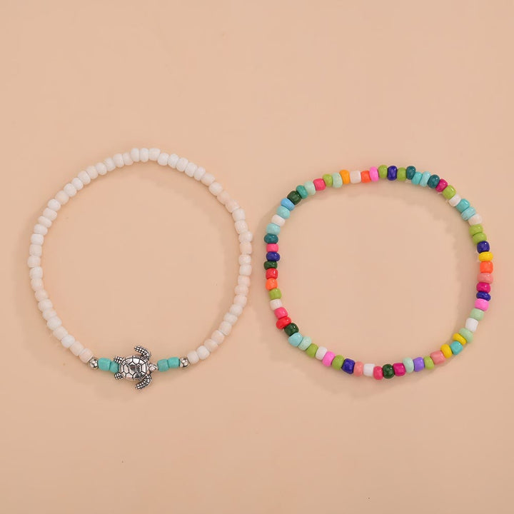Olivenorma 2 pezzi cavigliera tartaruga con perline colorate bianche