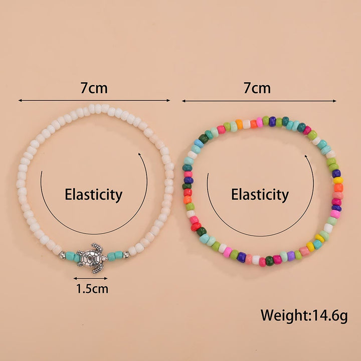 Olivenorma 2 pezzi cavigliera tartaruga con perline colorate bianche