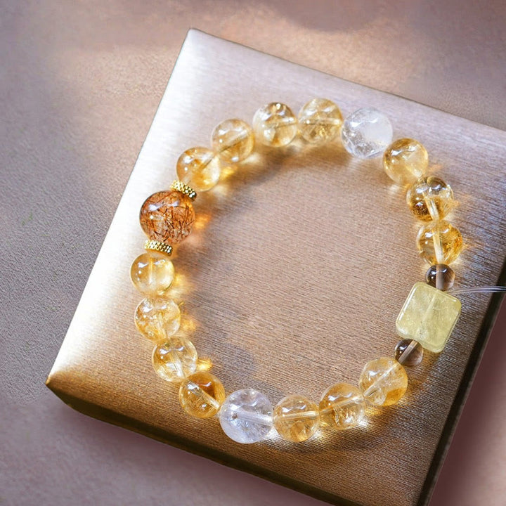Bracciale Olivenorma in oro con perline di quarzo rutilato e citrino
