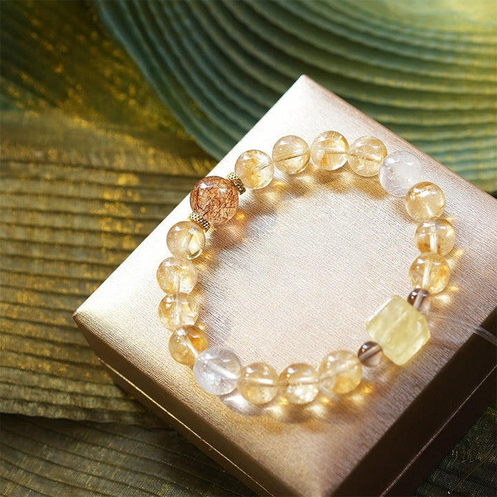 Bracciale Olivenorma in oro con perline di quarzo rutilato e citrino