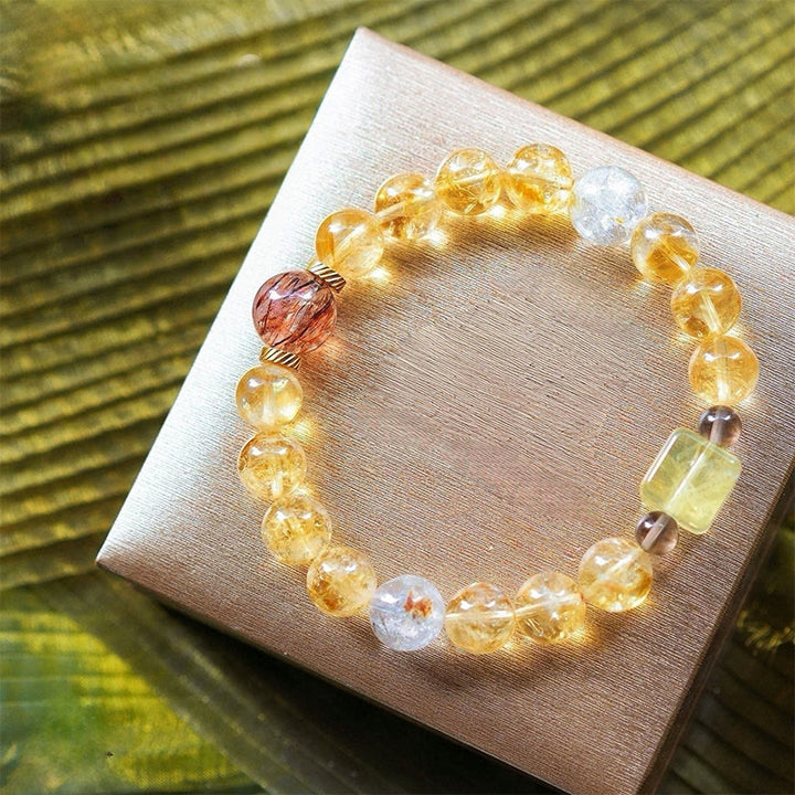 Bracciale Olivenorma in oro con perline di quarzo rutilato e citrino