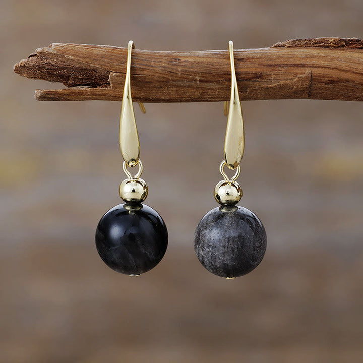 Orecchini pendenti con sfera di cristallo naturale Olivenorma
