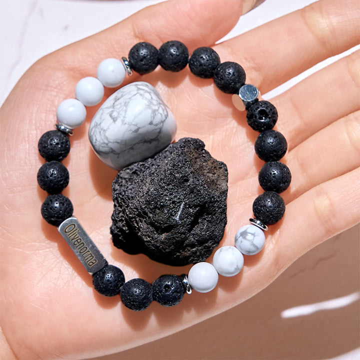 Bracciale Olivenorma in pietra lavica con perline turchesi bianche incise