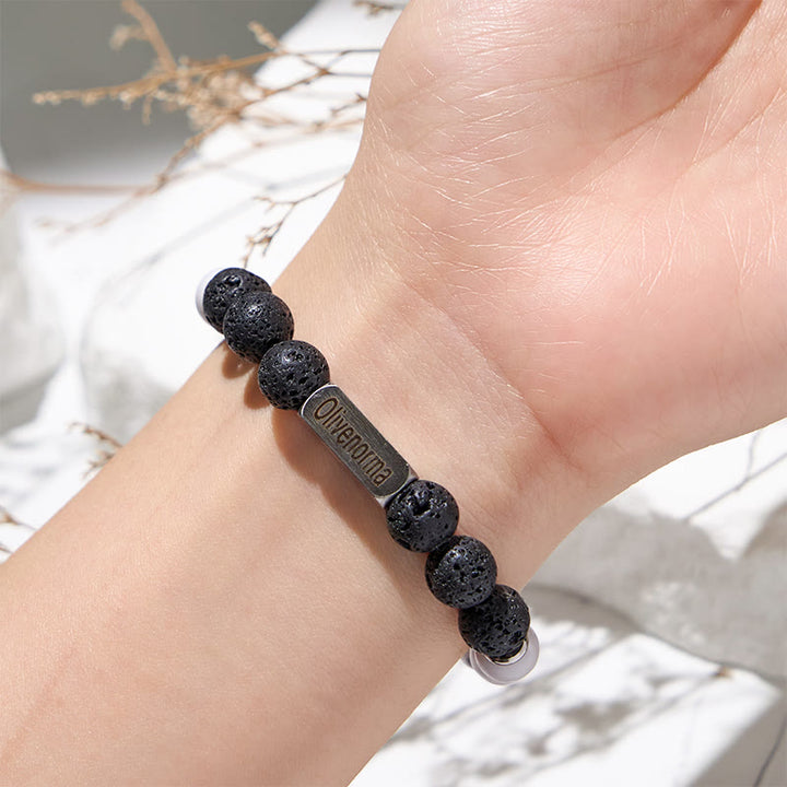Bracciale Olivenorma in pietra lavica con perline turchesi bianche incise