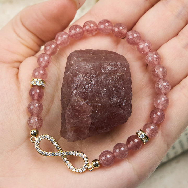 Bracciale con simbolo dell'infinito in perline di quarzo fragola naturale Olivenorma 